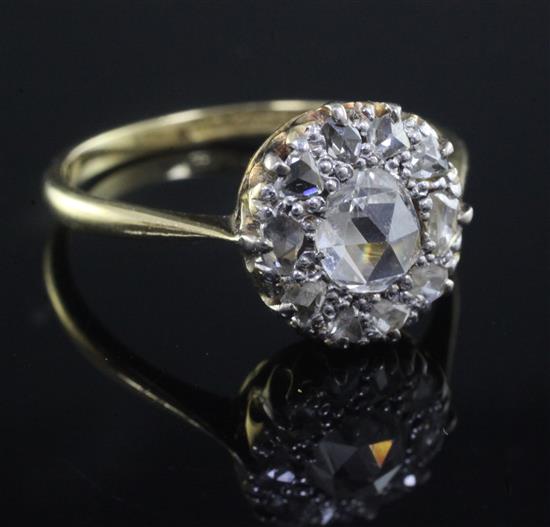 An 18ct gold, platinum and rose cut diamond set circular cluster ring, size P.